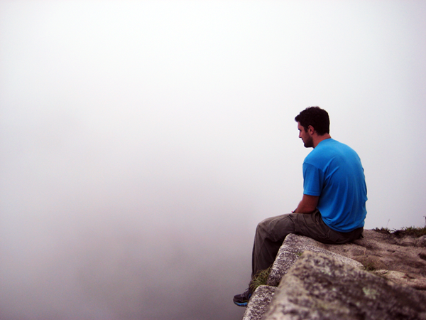 Sitting on top of Wayna Picchu waiting for the clouds to clear to view Machu Picchu