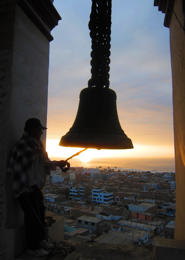 Ringing the evening bell in Huanchaco, Peru