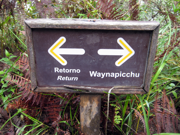 The sign to Huayna Picchu (waynapicchu) mountain at Machu Picchu