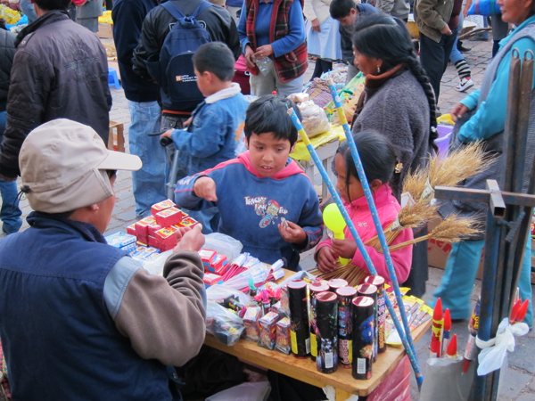 Kids Buying Fireworks on New Years Eve in Cusco Peru
